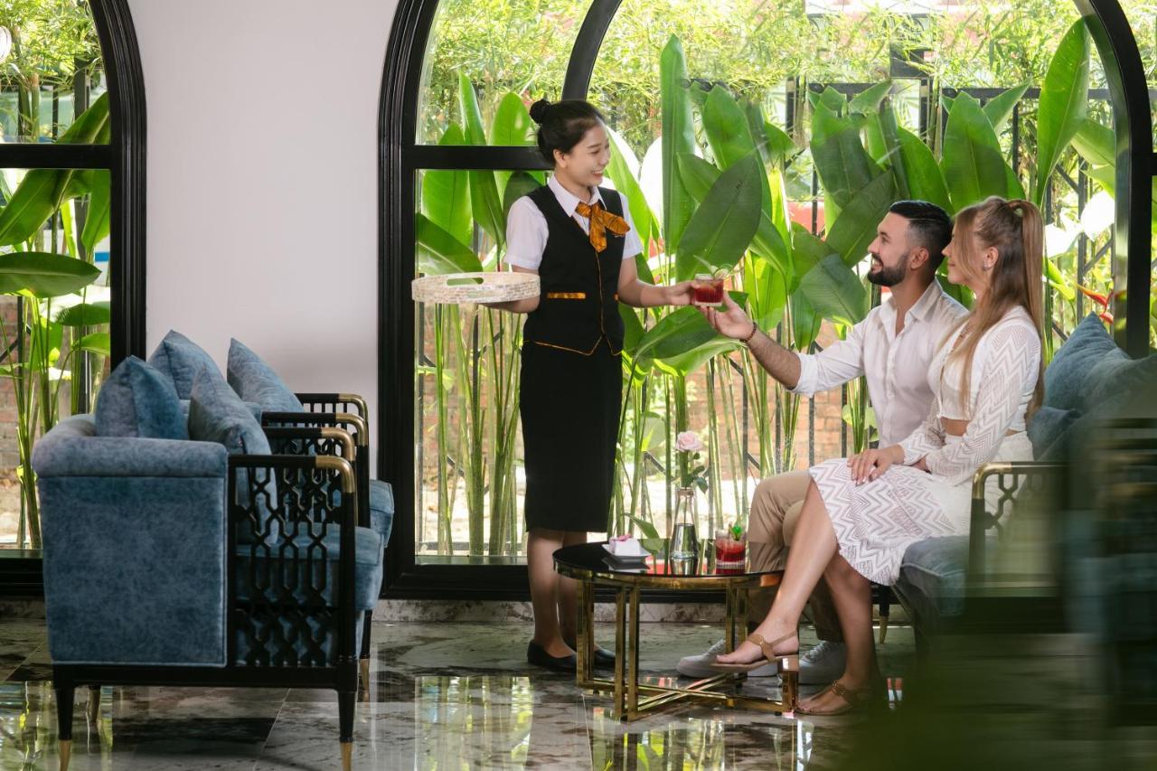 Grand Sunrise Palace Hoi An- A Luxury Indochine Hotel & Spa Exterior photo A hotel butler serving drinks